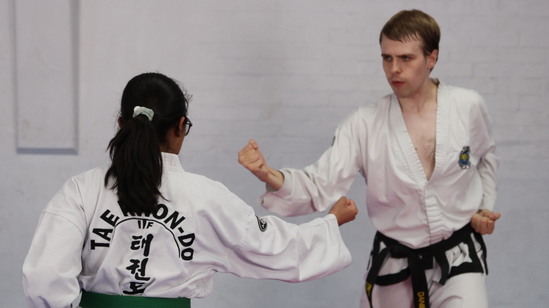 Daniel Beard demonstrating circular block while teaching a student.